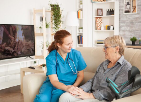 female-assistant-talking-with-senior-woman-EQ75DMW-scaled